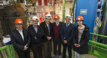 Professor Englert (orange hat, centre) in the underground cavern with the CMS detector