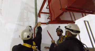 Members of the CMS Safety and Technical Coordination teams removing the foam outlet